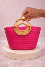 A Stylish and Casual Summer Vacation-style Large- capacity Solid-color Woven Paper Product with a Round Wooden Handle.