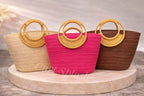A Stylish and Casual Summer Vacation-style Large- capacity Solid-color Woven Paper Product with a Round Wooden Handle.