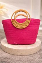A Stylish and Casual Summer Vacation-style Large- capacity Solid-color Woven Paper Product with a Round Wooden Handle.